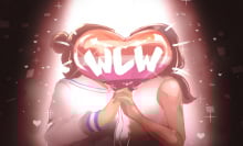 two women holding hands with wlw balloon in front of them