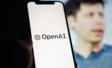 openai logo on a smartphone in front of an image of ceo sam altman
