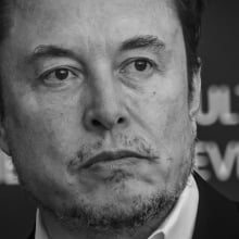 Elon Musk looking grim in black and white.