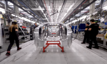 A flying view of a Tesla Gigafactory assembly line.