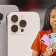 woman holding all 4 iPhone 16 models and smiling